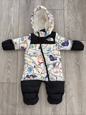 The North Face Infant Hooded Snowsuit in White with Black and Multicolor Print